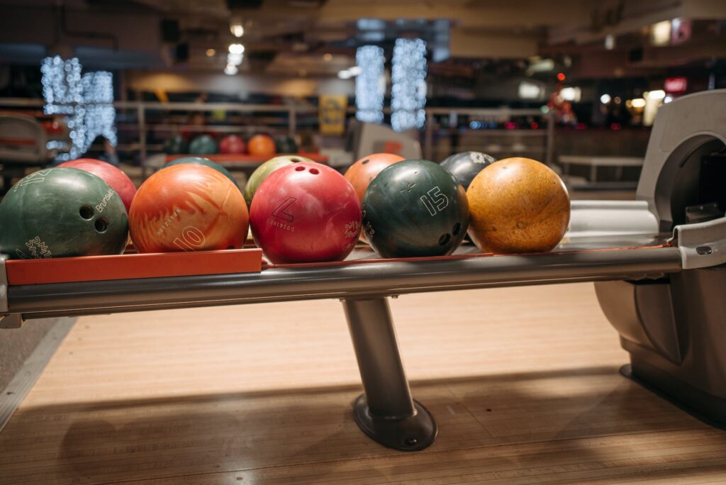 colorful bowling balls on a return system